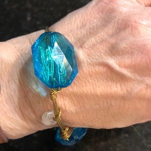 Blue jewel gold band bracelet